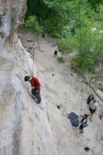 Me top rope climbing Diving for Rocks (5.10d) with Javier Morales belaying, photographed from  the third bolt of Magster (5.10a) by Andrew Dreher.  It was another long day of rock climbing at Seismic Wall on Austin's Barton Creek Greenbelt, Saturday, April 11, 2009.

Filename: SRM_20090411_17063604.JPG
Aperture: f/5.6
Shutter Speed: 1/320
Body: Canon EOS-1D Mark II
Lens: Canon EF 16-35mm f/2.8 L