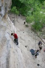 Me top rope climbing Diving for Rocks (5.10d) with Javier Morales belaying, photographed from  the third bolt of Magster (5.10a) by Andrew Dreher.  It was another long day of rock climbing at Seismic Wall on Austin's Barton Creek Greenbelt, Saturday, April 11, 2009.

Filename: SRM_20090411_17063705.JPG
Aperture: f/5.6
Shutter Speed: 1/320
Body: Canon EOS-1D Mark II
Lens: Canon EF 16-35mm f/2.8 L