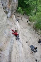 Me top rope climbing Diving for Rocks (5.10d) with Javier Morales belaying, photographed from  the third bolt of Magster (5.10a) by Andrew Dreher.  It was another long day of rock climbing at Seismic Wall on Austin's Barton Creek Greenbelt, Saturday, April 11, 2009.

Filename: SRM_20090411_17065607.JPG
Aperture: f/5.6
Shutter Speed: 1/320
Body: Canon EOS-1D Mark II
Lens: Canon EF 16-35mm f/2.8 L