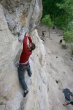 Me top rope climbing Diving for Rocks (5.10d) with Javier Morales belaying, photographed from  the third bolt of Magster (5.10a) by Andrew Dreher.  It was another long day of rock climbing at Seismic Wall on Austin's Barton Creek Greenbelt, Saturday, April 11, 2009.

Filename: SRM_20090411_17075218.JPG
Aperture: f/5.6
Shutter Speed: 1/320
Body: Canon EOS-1D Mark II
Lens: Canon EF 16-35mm f/2.8 L