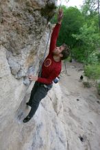 Me top rope climbing Diving for Rocks (5.10d), photographed from  the third bolt of Magster (5.10a) by Andrew Dreher.  It was another long day of rock climbing at Seismic Wall on Austin's Barton Creek Greenbelt, Saturday, April 11, 2009.

Filename: SRM_20090411_17081131.JPG
Aperture: f/5.6
Shutter Speed: 1/320
Body: Canon EOS-1D Mark II
Lens: Canon EF 16-35mm f/2.8 L