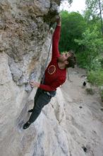 Me top rope climbing Diving for Rocks (5.10d), photographed from  the third bolt of Magster (5.10a) by Andrew Dreher.  It was another long day of rock climbing at Seismic Wall on Austin's Barton Creek Greenbelt, Saturday, April 11, 2009.

Filename: SRM_20090411_17081132.JPG
Aperture: f/5.6
Shutter Speed: 1/320
Body: Canon EOS-1D Mark II
Lens: Canon EF 16-35mm f/2.8 L