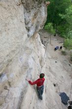 Me top rope climbing Diving for Rocks (5.10d), photographed from  the third bolt of Magster (5.10a) by Andrew Dreher.  It was another long day of rock climbing at Seismic Wall on Austin's Barton Creek Greenbelt, Saturday, April 11, 2009.

Filename: SRM_20090411_17093638.JPG
Aperture: f/5.6
Shutter Speed: 1/320
Body: Canon EOS-1D Mark II
Lens: Canon EF 16-35mm f/2.8 L