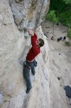 Me top rope climbing Diving for Rocks (5.10d), photographed from  the third bolt of Magster (5.10a) by Andrew Dreher.  It was another long day of rock climbing at Seismic Wall on Austin's Barton Creek Greenbelt, Saturday, April 11, 2009.

Filename: SRM_20090411_17101548.JPG
Aperture: f/5.6
Shutter Speed: 1/320
Body: Canon EOS-1D Mark II
Lens: Canon EF 16-35mm f/2.8 L