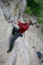 Me top rope climbing Diving for Rocks (5.10d), photographed from  the third bolt of Magster (5.10a) by Andrew Dreher.  It was another long day of rock climbing at Seismic Wall on Austin's Barton Creek Greenbelt, Saturday, April 11, 2009.

Filename: SRM_20090411_17103354.JPG
Aperture: f/5.6
Shutter Speed: 1/320
Body: Canon EOS-1D Mark II
Lens: Canon EF 16-35mm f/2.8 L