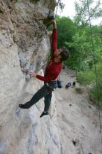 Me top rope climbing Diving for Rocks (5.10d), photographed from  the third bolt of Magster (5.10a) by Andrew Dreher.  It was another long day of rock climbing at Seismic Wall on Austin's Barton Creek Greenbelt, Saturday, April 11, 2009.

Filename: SRM_20090411_17103664.JPG
Aperture: f/5.6
Shutter Speed: 1/320
Body: Canon EOS-1D Mark II
Lens: Canon EF 16-35mm f/2.8 L