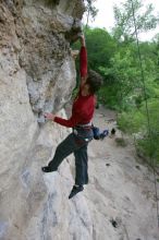 Me top rope climbing Diving for Rocks (5.10d), photographed from  the third bolt of Magster (5.10a) by Andrew Dreher.  It was another long day of rock climbing at Seismic Wall on Austin's Barton Creek Greenbelt, Saturday, April 11, 2009.

Filename: SRM_20090411_17103765.JPG
Aperture: f/5.6
Shutter Speed: 1/320
Body: Canon EOS-1D Mark II
Lens: Canon EF 16-35mm f/2.8 L