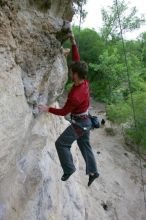 Me top rope climbing Diving for Rocks (5.10d), photographed from  the third bolt of Magster (5.10a) by Andrew Dreher.  It was another long day of rock climbing at Seismic Wall on Austin's Barton Creek Greenbelt, Saturday, April 11, 2009.

Filename: SRM_20090411_17103768.JPG
Aperture: f/5.6
Shutter Speed: 1/320
Body: Canon EOS-1D Mark II
Lens: Canon EF 16-35mm f/2.8 L