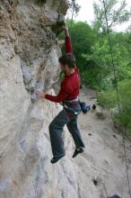 Me top rope climbing Diving for Rocks (5.10d), photographed from  the third bolt of Magster (5.10a) by Andrew Dreher.  It was another long day of rock climbing at Seismic Wall on Austin's Barton Creek Greenbelt, Saturday, April 11, 2009.

Filename: SRM_20090411_17103770.JPG
Aperture: f/5.6
Shutter Speed: 1/320
Body: Canon EOS-1D Mark II
Lens: Canon EF 16-35mm f/2.8 L