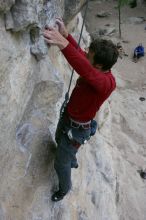 Me top rope climbing Diving for Rocks (5.10d), photographed from  the third bolt of Magster (5.10a) by Andrew Dreher.  It was another long day of rock climbing at Seismic Wall on Austin's Barton Creek Greenbelt, Saturday, April 11, 2009.

Filename: SRM_20090411_17125184.JPG
Aperture: f/5.6
Shutter Speed: 1/320
Body: Canon EOS-1D Mark II
Lens: Canon EF 16-35mm f/2.8 L