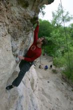 Me top rope climbing Diving for Rocks (5.10d), photographed from  the third bolt of Magster (5.10a) by Andrew Dreher.  It was another long day of rock climbing at Seismic Wall on Austin's Barton Creek Greenbelt, Saturday, April 11, 2009.

Filename: SRM_20090411_17125889.JPG
Aperture: f/5.6
Shutter Speed: 1/320
Body: Canon EOS-1D Mark II
Lens: Canon EF 16-35mm f/2.8 L