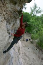 Me top rope climbing Diving for Rocks (5.10d), photographed from  the third bolt of Magster (5.10a) by Andrew Dreher.  It was another long day of rock climbing at Seismic Wall on Austin's Barton Creek Greenbelt, Saturday, April 11, 2009.

Filename: SRM_20090411_17125890.JPG
Aperture: f/5.6
Shutter Speed: 1/320
Body: Canon EOS-1D Mark II
Lens: Canon EF 16-35mm f/2.8 L