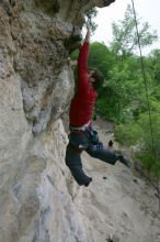 Me top rope climbing Diving for Rocks (5.10d), photographed from  the third bolt of Magster (5.10a) by Andrew Dreher.  It was another long day of rock climbing at Seismic Wall on Austin's Barton Creek Greenbelt, Saturday, April 11, 2009.

Filename: SRM_20090411_17125993.JPG
Aperture: f/5.6
Shutter Speed: 1/320
Body: Canon EOS-1D Mark II
Lens: Canon EF 16-35mm f/2.8 L