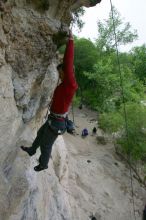 Me top rope climbing Diving for Rocks (5.10d), photographed from  the third bolt of Magster (5.10a) by Andrew Dreher.  It was another long day of rock climbing at Seismic Wall on Austin's Barton Creek Greenbelt, Saturday, April 11, 2009.

Filename: SRM_20090411_17130102.JPG
Aperture: f/5.6
Shutter Speed: 1/320
Body: Canon EOS-1D Mark II
Lens: Canon EF 16-35mm f/2.8 L