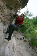 Me top rope climbing Diving for Rocks (5.10d), photographed from  the third bolt of Magster (5.10a) by Andrew Dreher.  It was another long day of rock climbing at Seismic Wall on Austin's Barton Creek Greenbelt, Saturday, April 11, 2009.

Filename: SRM_20090411_17130509.JPG
Aperture: f/5.6
Shutter Speed: 1/320
Body: Canon EOS-1D Mark II
Lens: Canon EF 16-35mm f/2.8 L