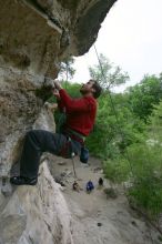 Me top rope climbing Diving for Rocks (5.10d), photographed from  the third bolt of Magster (5.10a) by Andrew Dreher.  It was another long day of rock climbing at Seismic Wall on Austin's Barton Creek Greenbelt, Saturday, April 11, 2009.

Filename: SRM_20090411_17132217.JPG
Aperture: f/5.6
Shutter Speed: 1/320
Body: Canon EOS-1D Mark II
Lens: Canon EF 16-35mm f/2.8 L