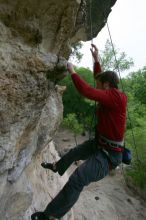 Me top rope climbing Diving for Rocks (5.10d), photographed from  the third bolt of Magster (5.10a) by Andrew Dreher.  It was another long day of rock climbing at Seismic Wall on Austin's Barton Creek Greenbelt, Saturday, April 11, 2009.

Filename: SRM_20090411_17133024.JPG
Aperture: f/5.6
Shutter Speed: 1/320
Body: Canon EOS-1D Mark II
Lens: Canon EF 16-35mm f/2.8 L