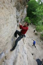 Me top rope climbing Diving for Rocks (5.10d), photographed from  the third bolt of Magster (5.10a) by Andrew Dreher.  It was another long day of rock climbing at Seismic Wall on Austin's Barton Creek Greenbelt, Saturday, April 11, 2009.

Filename: SRM_20090411_17164836.JPG
Aperture: f/5.6
Shutter Speed: 1/320
Body: Canon EOS-1D Mark II
Lens: Canon EF 16-35mm f/2.8 L