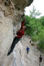 Me top rope climbing Diving for Rocks (5.10d), photographed from  the third bolt of Magster (5.10a) by Andrew Dreher.  It was another long day of rock climbing at Seismic Wall on Austin's Barton Creek Greenbelt, Saturday, April 11, 2009.

Filename: SRM_20090411_17164938.JPG
Aperture: f/5.6
Shutter Speed: 1/320
Body: Canon EOS-1D Mark II
Lens: Canon EF 16-35mm f/2.8 L