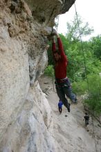 Me top rope climbing Diving for Rocks (5.10d), photographed from  the third bolt of Magster (5.10a) by Andrew Dreher.  It was another long day of rock climbing at Seismic Wall on Austin's Barton Creek Greenbelt, Saturday, April 11, 2009.

Filename: SRM_20090411_17165145.JPG
Aperture: f/5.6
Shutter Speed: 1/320
Body: Canon EOS-1D Mark II
Lens: Canon EF 16-35mm f/2.8 L