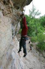 Me top rope climbing Diving for Rocks (5.10d), photographed from  the third bolt of Magster (5.10a) by Andrew Dreher.  It was another long day of rock climbing at Seismic Wall on Austin's Barton Creek Greenbelt, Saturday, April 11, 2009.

Filename: SRM_20090411_17165251.JPG
Aperture: f/5.6
Shutter Speed: 1/320
Body: Canon EOS-1D Mark II
Lens: Canon EF 16-35mm f/2.8 L