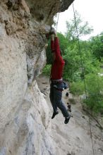 Me top rope climbing Diving for Rocks (5.10d), photographed from  the third bolt of Magster (5.10a) by Andrew Dreher.  It was another long day of rock climbing at Seismic Wall on Austin's Barton Creek Greenbelt, Saturday, April 11, 2009.

Filename: SRM_20090411_17165352.JPG
Aperture: f/5.6
Shutter Speed: 1/320
Body: Canon EOS-1D Mark II
Lens: Canon EF 16-35mm f/2.8 L