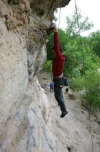 Me top rope climbing Diving for Rocks (5.10d), photographed from  the third bolt of Magster (5.10a) by Andrew Dreher.  It was another long day of rock climbing at Seismic Wall on Austin's Barton Creek Greenbelt, Saturday, April 11, 2009.

Filename: SRM_20090411_17165553.JPG
Aperture: f/5.6
Shutter Speed: 1/320
Body: Canon EOS-1D Mark II
Lens: Canon EF 16-35mm f/2.8 L