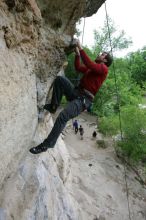 Me top rope climbing Diving for Rocks (5.10d), photographed from  the third bolt of Magster (5.10a) by Andrew Dreher.  It was another long day of rock climbing at Seismic Wall on Austin's Barton Creek Greenbelt, Saturday, April 11, 2009.

Filename: SRM_20090411_17165756.JPG
Aperture: f/5.6
Shutter Speed: 1/320
Body: Canon EOS-1D Mark II
Lens: Canon EF 16-35mm f/2.8 L