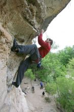 Me top rope climbing Diving for Rocks (5.10d), photographed from  the third bolt of Magster (5.10a) by Andrew Dreher.  It was another long day of rock climbing at Seismic Wall on Austin's Barton Creek Greenbelt, Saturday, April 11, 2009.

Filename: SRM_20090411_17170063.JPG
Aperture: f/5.6
Shutter Speed: 1/320
Body: Canon EOS-1D Mark II
Lens: Canon EF 16-35mm f/2.8 L