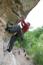 Me top rope climbing Diving for Rocks (5.10d), photographed from  the third bolt of Magster (5.10a) by Andrew Dreher.  It was another long day of rock climbing at Seismic Wall on Austin's Barton Creek Greenbelt, Saturday, April 11, 2009.

Filename: SRM_20090411_17170164.JPG
Aperture: f/5.6
Shutter Speed: 1/320
Body: Canon EOS-1D Mark II
Lens: Canon EF 16-35mm f/2.8 L