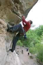 Me top rope climbing Diving for Rocks (5.10d), photographed from  the third bolt of Magster (5.10a) by Andrew Dreher.  It was another long day of rock climbing at Seismic Wall on Austin's Barton Creek Greenbelt, Saturday, April 11, 2009.

Filename: SRM_20090411_17170165.JPG
Aperture: f/5.6
Shutter Speed: 1/320
Body: Canon EOS-1D Mark II
Lens: Canon EF 16-35mm f/2.8 L