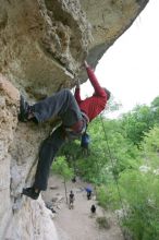 Me top rope climbing Diving for Rocks (5.10d), photographed from  the third bolt of Magster (5.10a) by Andrew Dreher.  It was another long day of rock climbing at Seismic Wall on Austin's Barton Creek Greenbelt, Saturday, April 11, 2009.

Filename: SRM_20090411_17170366.JPG
Aperture: f/5.6
Shutter Speed: 1/320
Body: Canon EOS-1D Mark II
Lens: Canon EF 16-35mm f/2.8 L