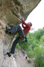 Me top rope climbing Diving for Rocks (5.10d), photographed from  the third bolt of Magster (5.10a) by Andrew Dreher.  It was another long day of rock climbing at Seismic Wall on Austin's Barton Creek Greenbelt, Saturday, April 11, 2009.

Filename: SRM_20090411_17170768.JPG
Aperture: f/5.6
Shutter Speed: 1/320
Body: Canon EOS-1D Mark II
Lens: Canon EF 16-35mm f/2.8 L