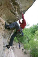 Me top rope climbing Diving for Rocks (5.10d), photographed from  the third bolt of Magster (5.10a) by Andrew Dreher.  It was another long day of rock climbing at Seismic Wall on Austin's Barton Creek Greenbelt, Saturday, April 11, 2009.

Filename: SRM_20090411_17170869.JPG
Aperture: f/5.6
Shutter Speed: 1/320
Body: Canon EOS-1D Mark II
Lens: Canon EF 16-35mm f/2.8 L