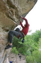 Me top rope climbing Diving for Rocks (5.10d), photographed from  the third bolt of Magster (5.10a) by Andrew Dreher.  It was another long day of rock climbing at Seismic Wall on Austin's Barton Creek Greenbelt, Saturday, April 11, 2009.

Filename: SRM_20090411_17171372.JPG
Aperture: f/5.6
Shutter Speed: 1/320
Body: Canon EOS-1D Mark II
Lens: Canon EF 16-35mm f/2.8 L