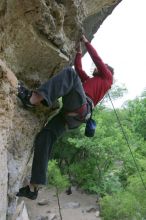 Me top rope climbing Diving for Rocks (5.10d), photographed from  the third bolt of Magster (5.10a) by Andrew Dreher.  It was another long day of rock climbing at Seismic Wall on Austin's Barton Creek Greenbelt, Saturday, April 11, 2009.

Filename: SRM_20090411_17180477.JPG
Aperture: f/5.6
Shutter Speed: 1/320
Body: Canon EOS-1D Mark II
Lens: Canon EF 16-35mm f/2.8 L