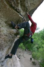 Me top rope climbing Diving for Rocks (5.10d), photographed from  the third bolt of Magster (5.10a) by Andrew Dreher.  It was another long day of rock climbing at Seismic Wall on Austin's Barton Creek Greenbelt, Saturday, April 11, 2009.

Filename: SRM_20090411_17185879.JPG
Aperture: f/5.6
Shutter Speed: 1/320
Body: Canon EOS-1D Mark II
Lens: Canon EF 16-35mm f/2.8 L