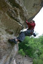 Me top rope climbing Diving for Rocks (5.10d), photographed from  the third bolt of Magster (5.10a) by Andrew Dreher.  It was another long day of rock climbing at Seismic Wall on Austin's Barton Creek Greenbelt, Saturday, April 11, 2009.

Filename: SRM_20090411_17190280.JPG
Aperture: f/5.6
Shutter Speed: 1/320
Body: Canon EOS-1D Mark II
Lens: Canon EF 16-35mm f/2.8 L