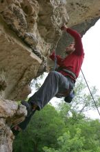 Me top rope climbing Diving for Rocks (5.10d), photographed from  the third bolt of Magster (5.10a) by Andrew Dreher.  It was another long day of rock climbing at Seismic Wall on Austin's Barton Creek Greenbelt, Saturday, April 11, 2009.

Filename: SRM_20090411_17200885.JPG
Aperture: f/5.6
Shutter Speed: 1/320
Body: Canon EOS-1D Mark II
Lens: Canon EF 16-35mm f/2.8 L