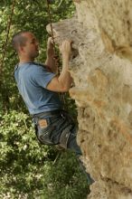 Sean O'Grady climbs in just running shoes.  CTM hosted a speed climbing event at Seismic Wall on Diving for Rocks to benefit the Austin Area Food Bank, Saturday, May 9, 2009.

Filename: SRM_20090509_11320116.jpg
Aperture: f/5.6
Shutter Speed: 1/500
Body: Canon EOS-1D Mark II
Lens: Canon EF 80-200mm f/2.8 L