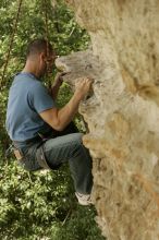 Sean O'Grady climbs in just running shoes.  CTM hosted a speed climbing event at Seismic Wall on Diving for Rocks to benefit the Austin Area Food Bank, Saturday, May 9, 2009.

Filename: SRM_20090509_11320319.jpg
Aperture: f/5.6
Shutter Speed: 1/500
Body: Canon EOS-1D Mark II
Lens: Canon EF 80-200mm f/2.8 L