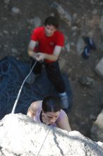 Beth Marek top rope climbing Roo Dog (5.8) with Andrew Dreher belaying, taken from the anchors of the route.  It was Beth's third time outside, and another long day of rock climbing at Seismic Wall on Austin's Barton Creek Greenbelt, Monday, May 25, 2009.

Filename: SRM_20090525_09404778.JPG
Aperture: f/4.0
Shutter Speed: 1/400
Body: Canon EOS-1D Mark II
Lens: Canon EF 80-200mm f/2.8 L