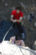 Beth Marek top rope climbing Roo Dog (5.8) with Andrew Dreher belaying, taken from the anchors of the route.  It was Beth's third time outside, and another long day of rock climbing at Seismic Wall on Austin's Barton Creek Greenbelt, Monday, May 25, 2009.

Filename: SRM_20090525_09404779.JPG
Aperture: f/4.0
Shutter Speed: 1/400
Body: Canon EOS-1D Mark II
Lens: Canon EF 80-200mm f/2.8 L