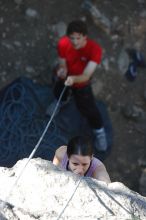 Beth Marek top rope climbing Roo Dog (5.8) with Andrew Dreher belaying, taken from the anchors of the route.  It was Beth's third time outside, and another long day of rock climbing at Seismic Wall on Austin's Barton Creek Greenbelt, Monday, May 25, 2009.

Filename: SRM_20090525_09405081.JPG
Aperture: f/4.0
Shutter Speed: 1/400
Body: Canon EOS-1D Mark II
Lens: Canon EF 80-200mm f/2.8 L