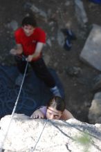 Beth Marek top rope climbing Roo Dog (5.8) with Andrew Dreher belaying, taken from the anchors of the route.  It was Beth's third time outside, and another long day of rock climbing at Seismic Wall on Austin's Barton Creek Greenbelt, Monday, May 25, 2009.

Filename: SRM_20090525_09411688.JPG
Aperture: f/4.0
Shutter Speed: 1/500
Body: Canon EOS-1D Mark II
Lens: Canon EF 80-200mm f/2.8 L