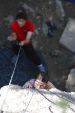 Beth Marek top rope climbing Roo Dog (5.8) with Andrew Dreher belaying, taken from the anchors of the route.  It was Beth's third time outside, and another long day of rock climbing at Seismic Wall on Austin's Barton Creek Greenbelt, Monday, May 25, 2009.

Filename: SRM_20090525_09411688.JPG
Aperture: f/4.0
Shutter Speed: 1/500
Body: Canon EOS-1D Mark II
Lens: Canon EF 80-200mm f/2.8 L