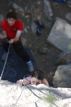 Beth Marek top rope climbing Roo Dog (5.8) with Andrew Dreher belaying, taken from the anchors of the route.  It was Beth's third time outside, and another long day of rock climbing at Seismic Wall on Austin's Barton Creek Greenbelt, Monday, May 25, 2009.

Filename: SRM_20090525_09411789.JPG
Aperture: f/4.0
Shutter Speed: 1/500
Body: Canon EOS-1D Mark II
Lens: Canon EF 80-200mm f/2.8 L