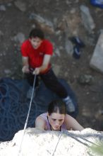 Beth Marek top rope climbing Roo Dog (5.8) with Andrew Dreher belaying, taken from the anchors of the route.  It was Beth's third time outside, and another long day of rock climbing at Seismic Wall on Austin's Barton Creek Greenbelt, Monday, May 25, 2009.

Filename: SRM_20090525_09412790.JPG
Aperture: f/4.0
Shutter Speed: 1/320
Body: Canon EOS-1D Mark II
Lens: Canon EF 80-200mm f/2.8 L