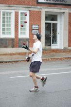 Barry Goldmeier, bib #16608 (8K) and  #5587 (marathon) juggling and running the 8K at the Richmond SunTrust Marathon and McDonald's Half Marathon, on Saturday, November 14, 2009.

Filename: SRM_20091114_07573265.JPG
Aperture: f/2.8
Shutter Speed: 1/320
Body: Canon EOS-1D Mark II
Lens: Canon EF 80-200mm f/2.8 L