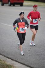 Beth Marek running the Rocket City Marathon on Saturday, December 12, 2009 in Huntsville.

Filename: SRM_20091212_12022432.JPG
Aperture: f/2.8
Shutter Speed: 1/800
Body: Canon EOS-1D Mark II
Lens: Canon EF 80-200mm f/2.8 L